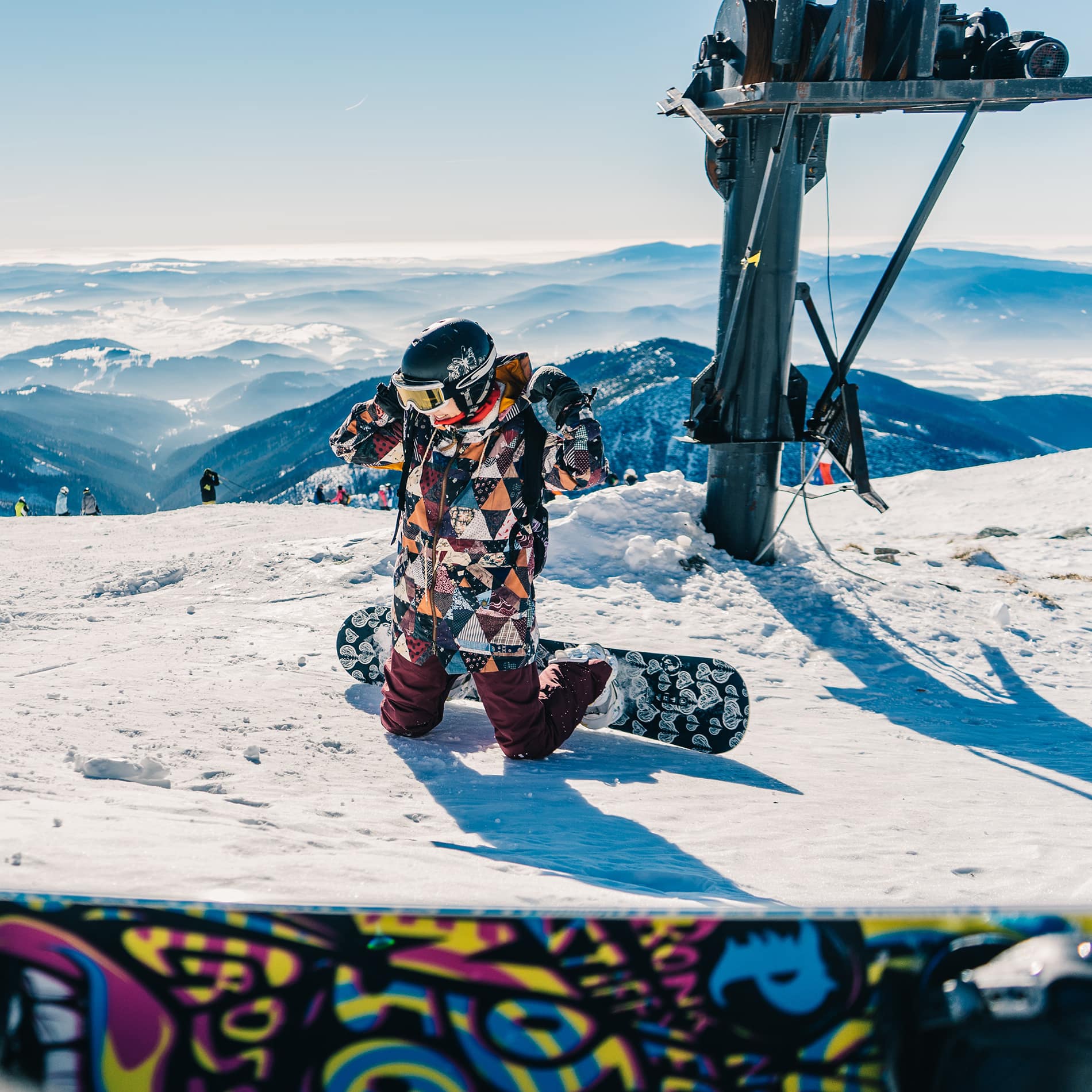 Snowboarder with mountain view