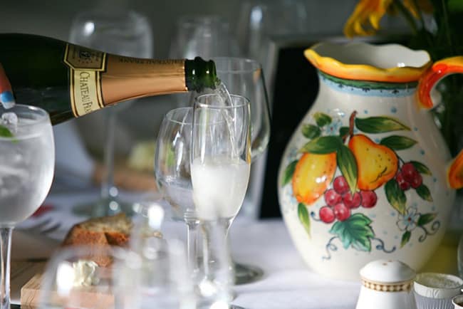 photo of champagne being poured into a flute