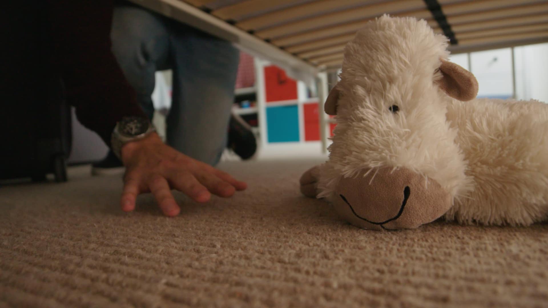 stuffed animal being found under the bed at a vacation home